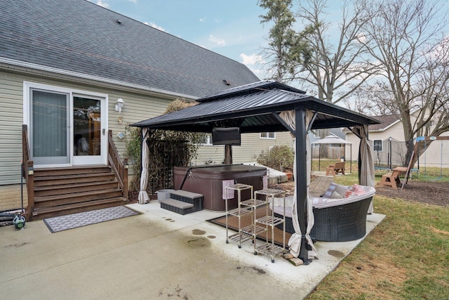 view of patio / terrace with a gazebo and a hot tub