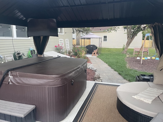 view of patio with a hot tub