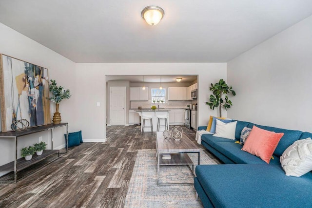 living room with dark wood-type flooring