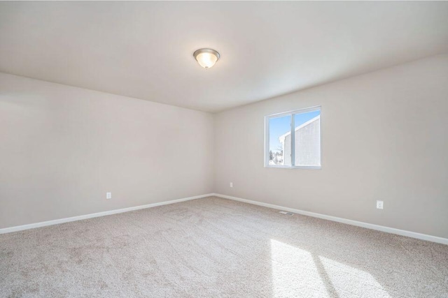 empty room featuring carpet flooring