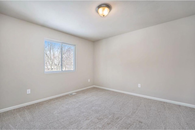 unfurnished room featuring carpet floors