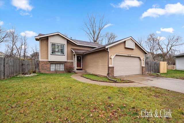 view of front of property with a garage and a front lawn