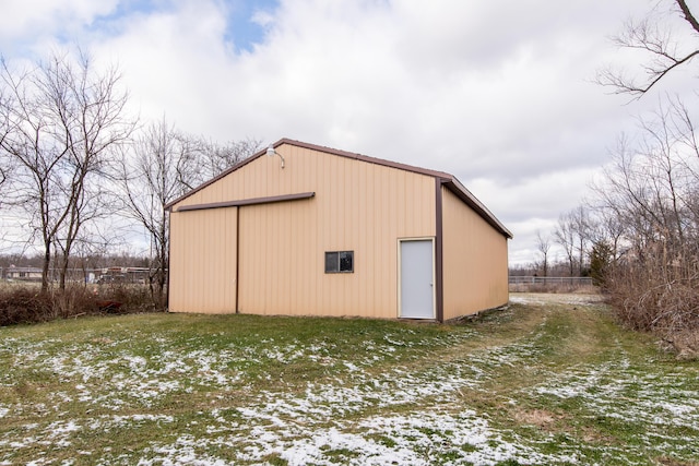 snow covered structure featuring a yard