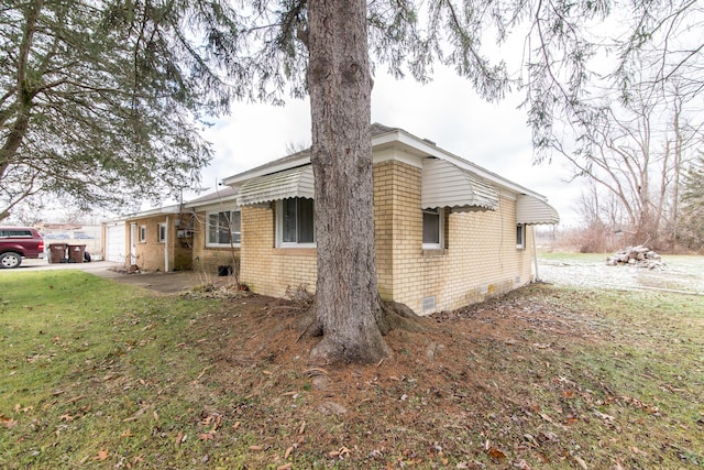 view of property exterior with a yard