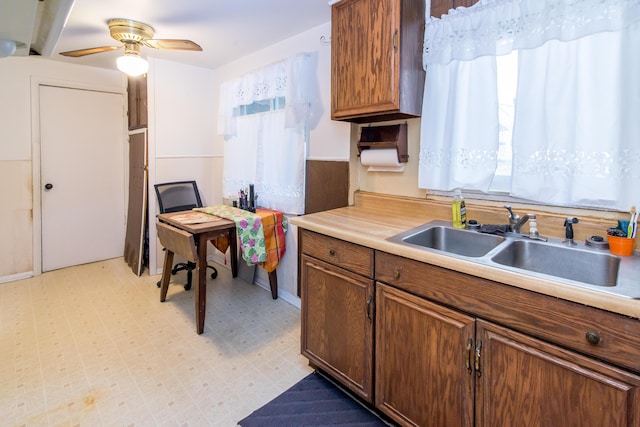 kitchen with ceiling fan and sink