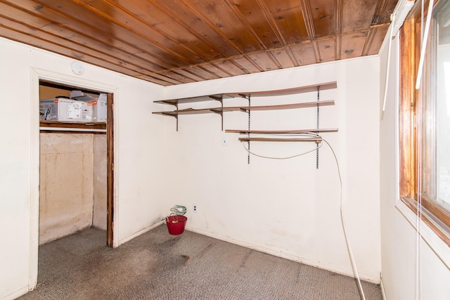 interior space with carpet and wooden ceiling