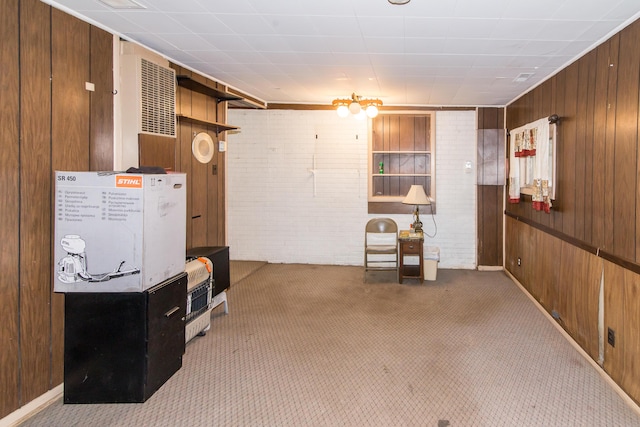 basement with carpet floors and wood walls