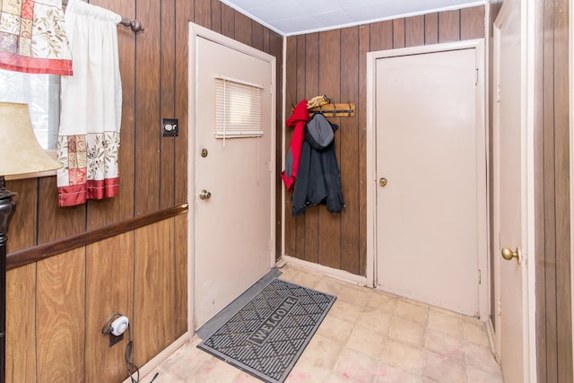 entryway with wooden walls