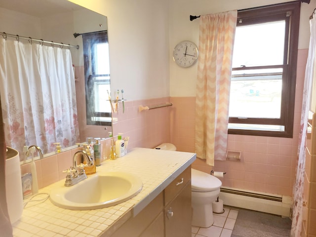 bathroom featuring a baseboard radiator, tile patterned flooring, toilet, vanity, and tile walls