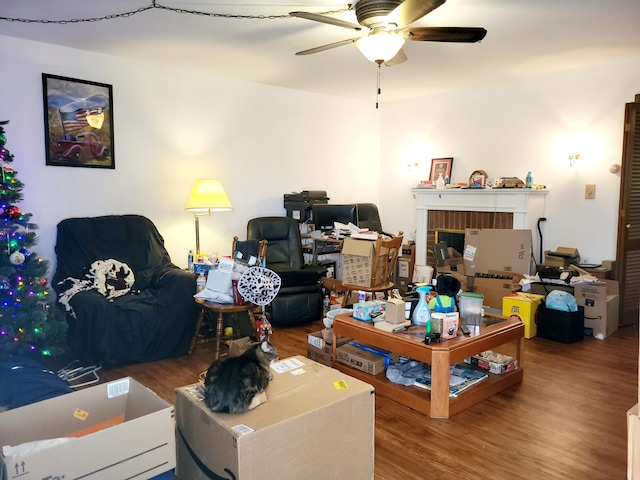 living room featuring hardwood / wood-style flooring and ceiling fan