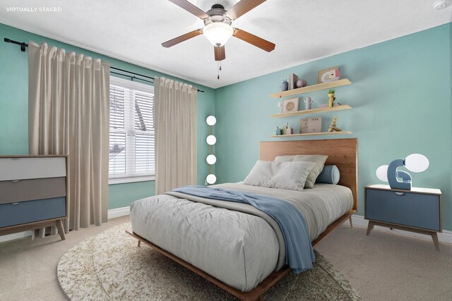 carpeted bedroom with ceiling fan