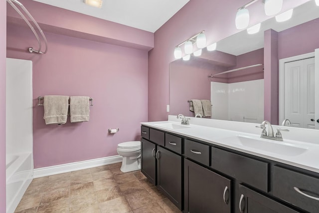 full bathroom featuring shower / tub combination, vanity, and toilet