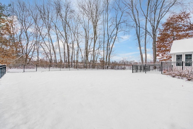 view of yard layered in snow