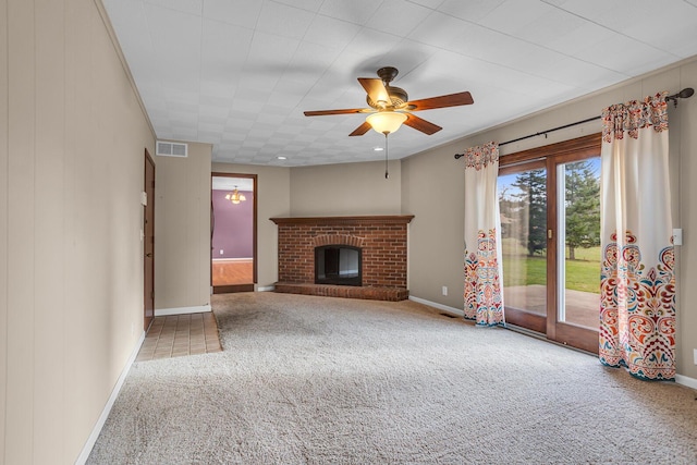 unfurnished living room featuring carpet flooring, ceiling fan, and a fireplace