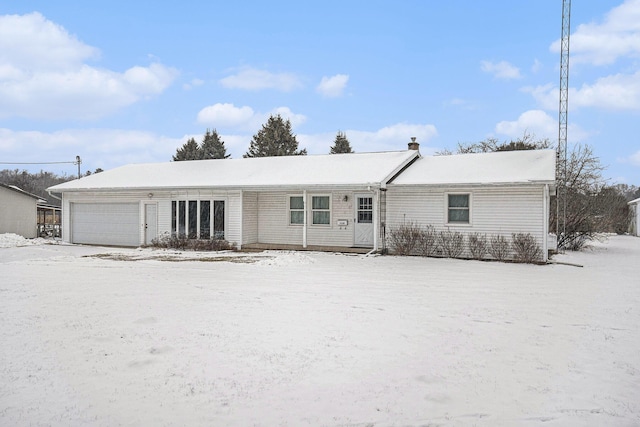 ranch-style house featuring a garage