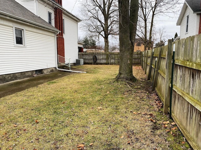 view of yard with central air condition unit