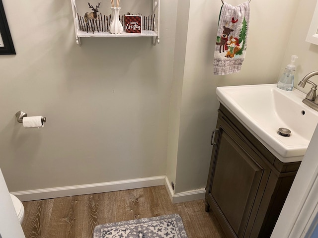 bathroom with vanity and hardwood / wood-style flooring