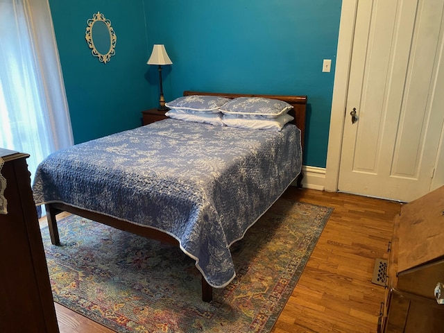 bedroom featuring wood-type flooring