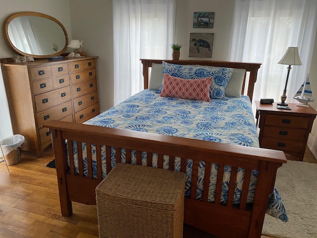 bedroom with wood-type flooring