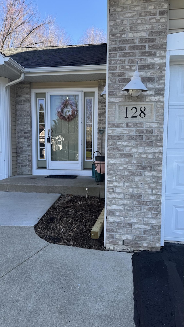 entrance to property featuring a garage