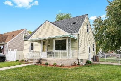 bungalow-style home featuring a porch and a front lawn