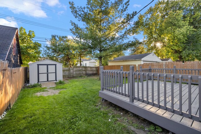 view of yard with a shed and a wooden deck