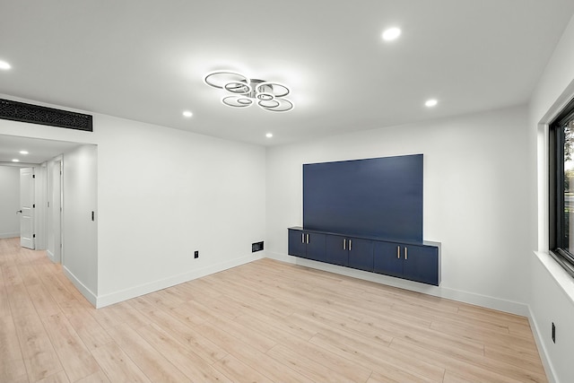 unfurnished living room featuring light hardwood / wood-style flooring