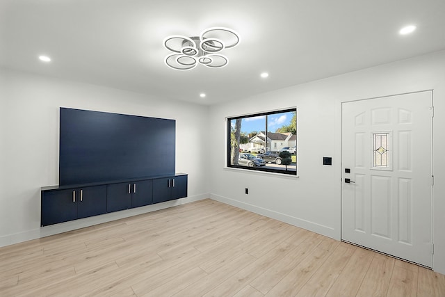 unfurnished living room featuring light hardwood / wood-style flooring