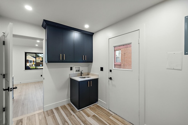 laundry room featuring cabinets, sink, and hookup for a washing machine