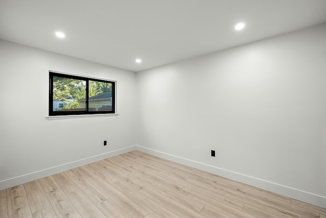 spare room featuring light wood-type flooring