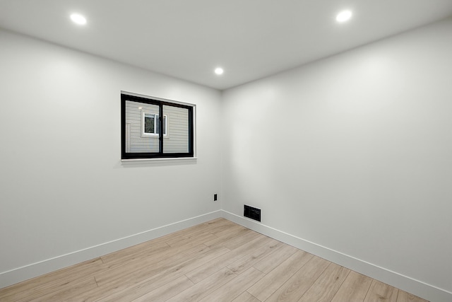 spare room with light hardwood / wood-style flooring