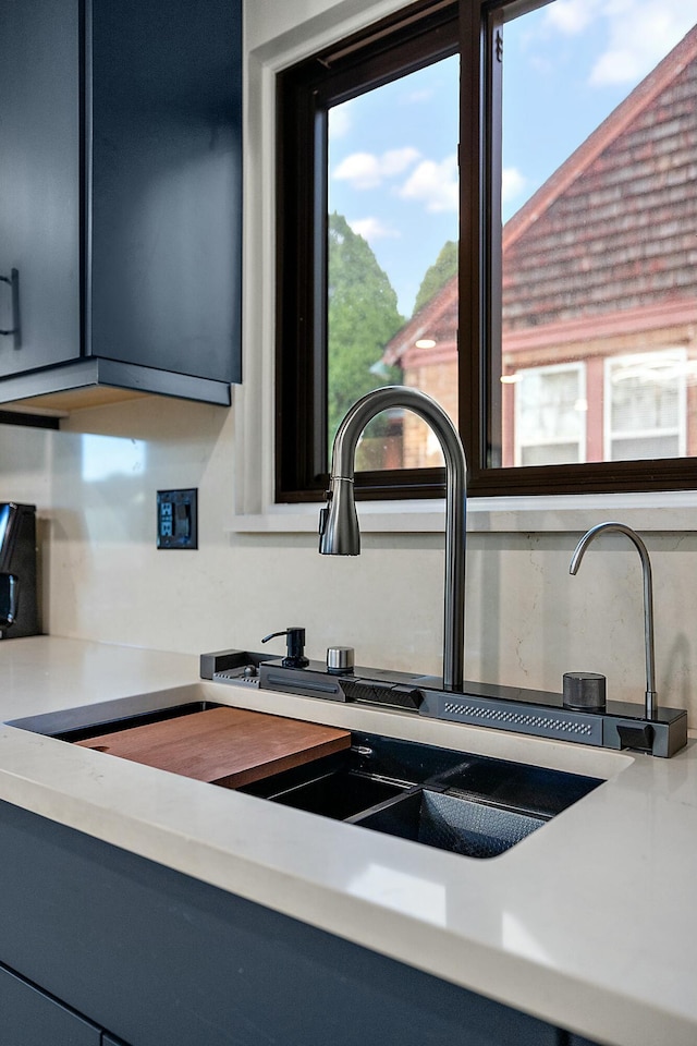 room details with blue cabinets and sink