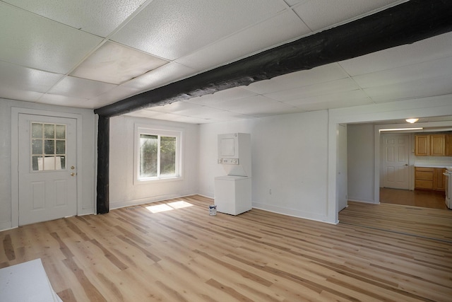 interior space with light wood-type flooring and a drop ceiling