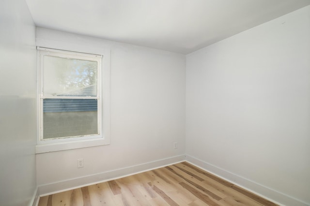 empty room with light hardwood / wood-style flooring