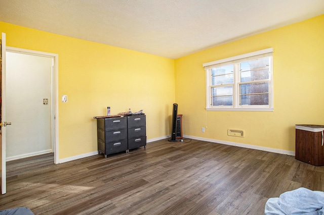 unfurnished room with dark hardwood / wood-style floors