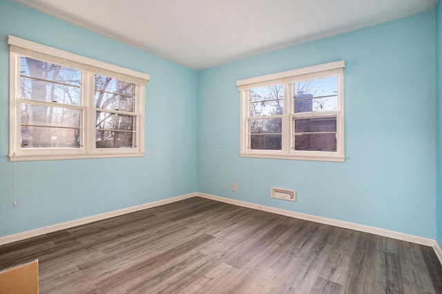 spare room featuring hardwood / wood-style flooring