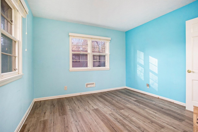 unfurnished room featuring hardwood / wood-style floors