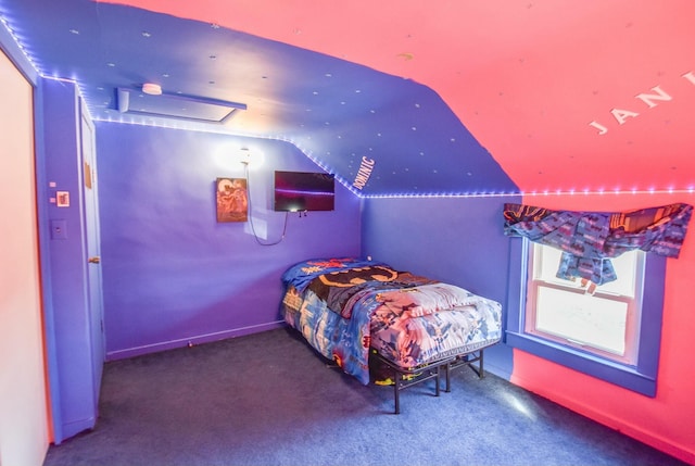 bedroom featuring carpet flooring and lofted ceiling