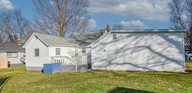 rear view of house with a lawn