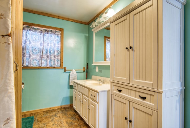 bathroom featuring vanity and ornamental molding