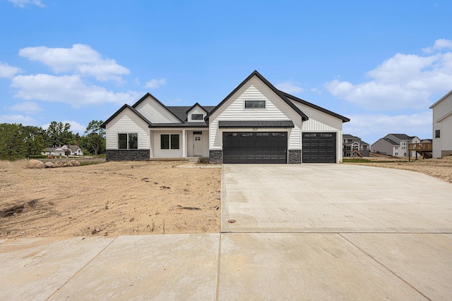 3545 Conrail Dr, Byron Center, MI 49315 - modern farmhouse featuring stone siding and concrete driveway
