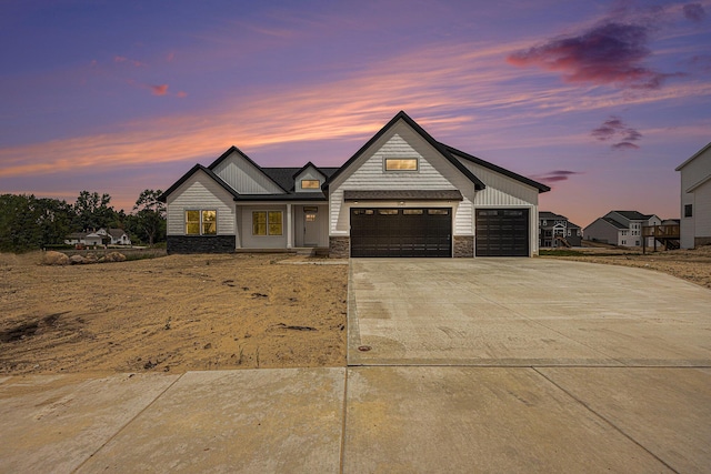 3545 Conrail Dr, Byron Center, MI 49315 - modern inspired farmhouse with driveway, stone siding, and a garage