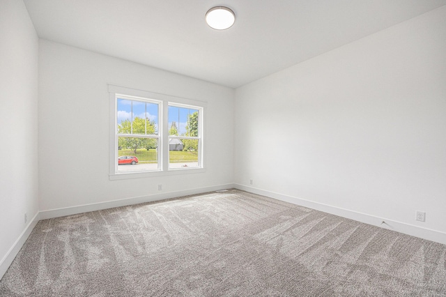 3545 Conrail Dr, Byron Center, MI 49315 - spare room with baseboards and carpet flooring