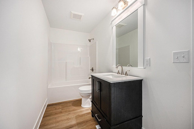 3545 Conrail Dr, Byron Center, MI 49315 - bathroom with toilet, vanity, wood finished floors, bathing tub / shower combination, and baseboards