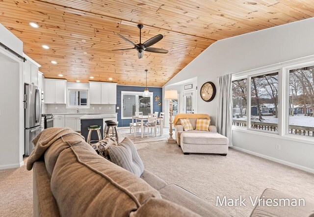 living room featuring light carpet, ceiling fan, lofted ceiling, and wood ceiling