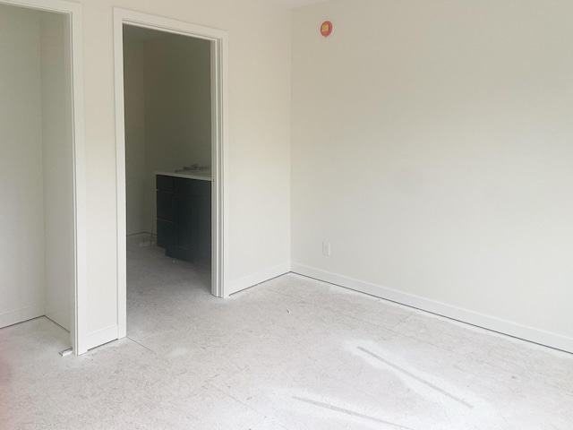 1979 N Shorewood Ln Unit 7, Holland, MI 49423 - unfurnished bedroom with baseboards