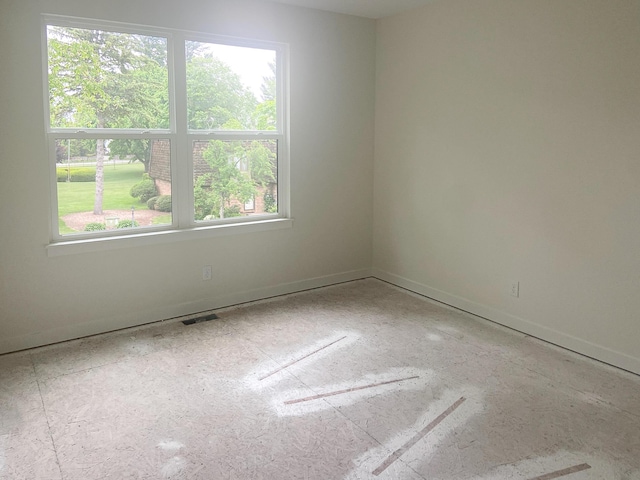 1979 N Shorewood Ln Unit 7, Holland, MI 49423 - spare room featuring baseboards