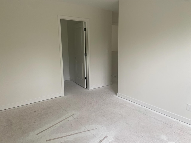 1979 N Shorewood Ln Unit 7, Holland, MI 49423 - spare room featuring baseboards