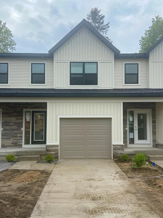 1979 N Shorewood Ln Unit 7, Holland, MI 49423 - multi unit property featuring board and batten siding, driveway, an attached garage, and covered porch