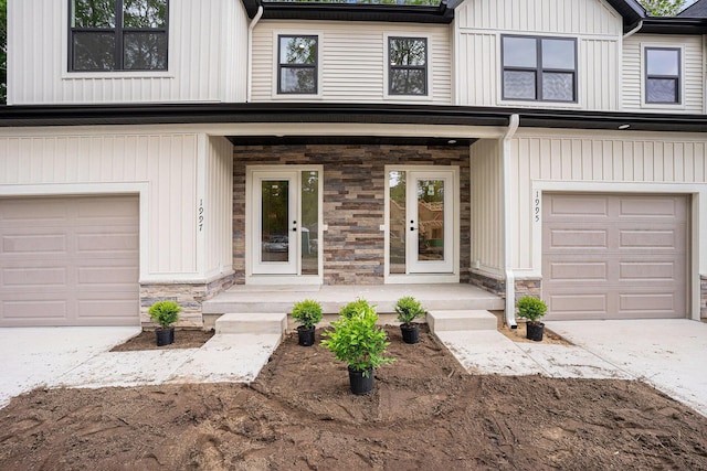 1979 N Shorewood Ln Unit 7, Holland, MI 49423 - view of front facade with stone siding, a porch, concrete driveway, and an attached garage
